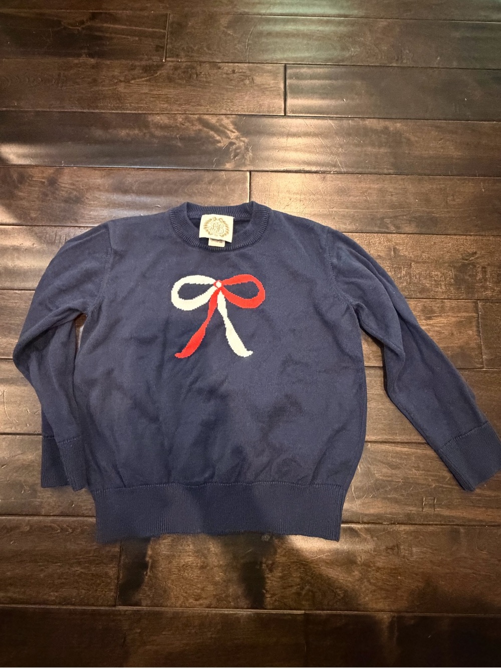 The Beaufort Bonnet Company Navy Kids Sweater with Red & White Bow